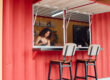 A shipping container food stand highlights the benefits over a food truck.