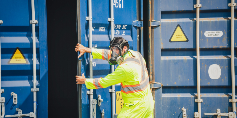 shipping-container-disaster-relief Image of a worker working in shipping container for disaster relief.