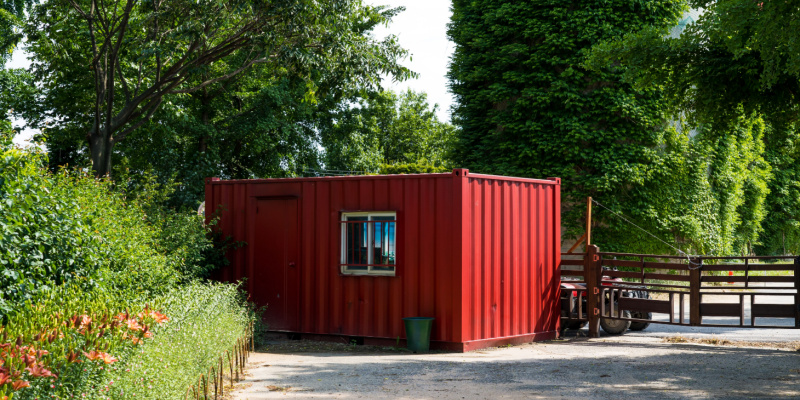 container-home A small red container home at a farm.